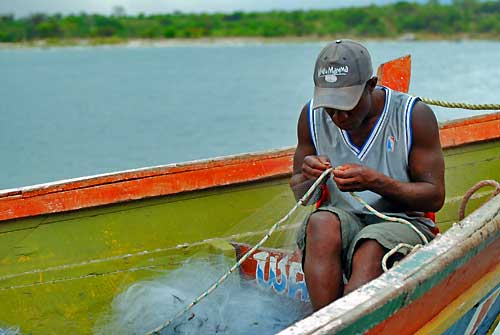 Fisherman repared a net.