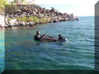 fishermen catching wild cichlids on the Mvuna shore.